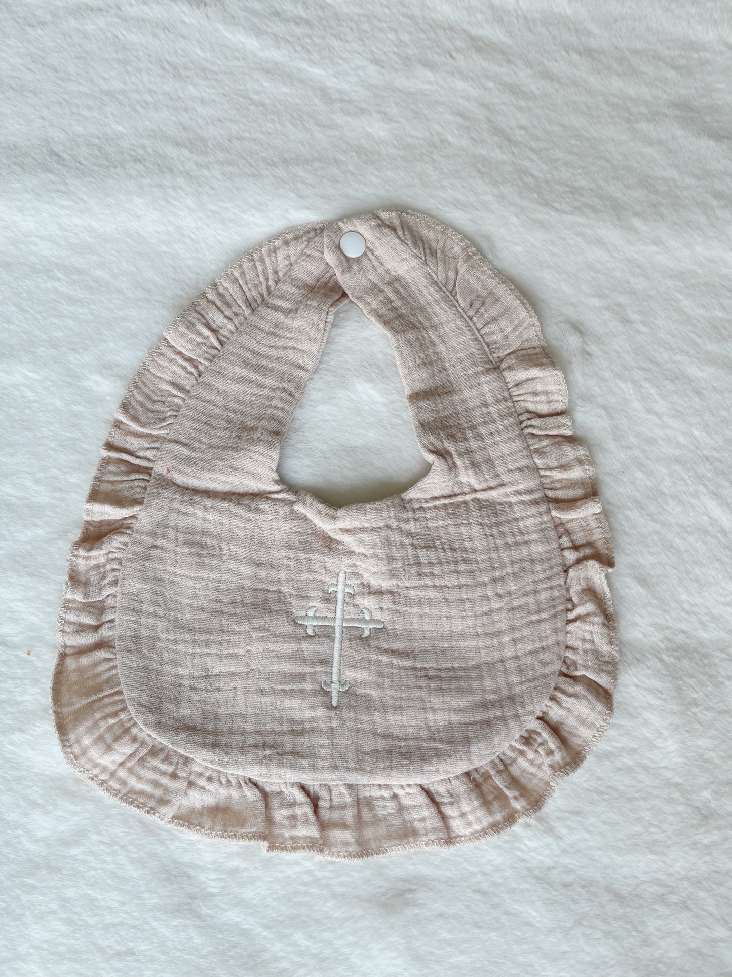 Ruffle Bib with Embroidered Cross