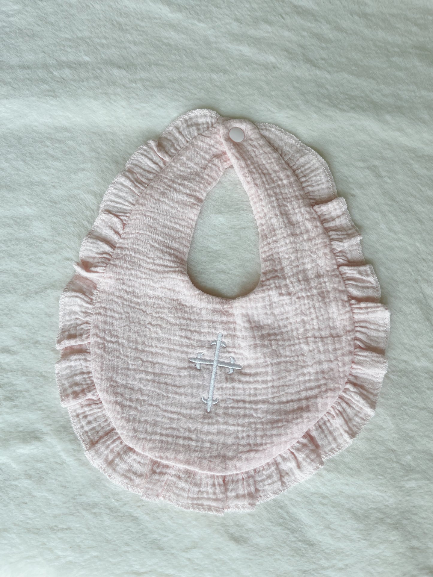 Ruffle Bib with Embroidered Cross