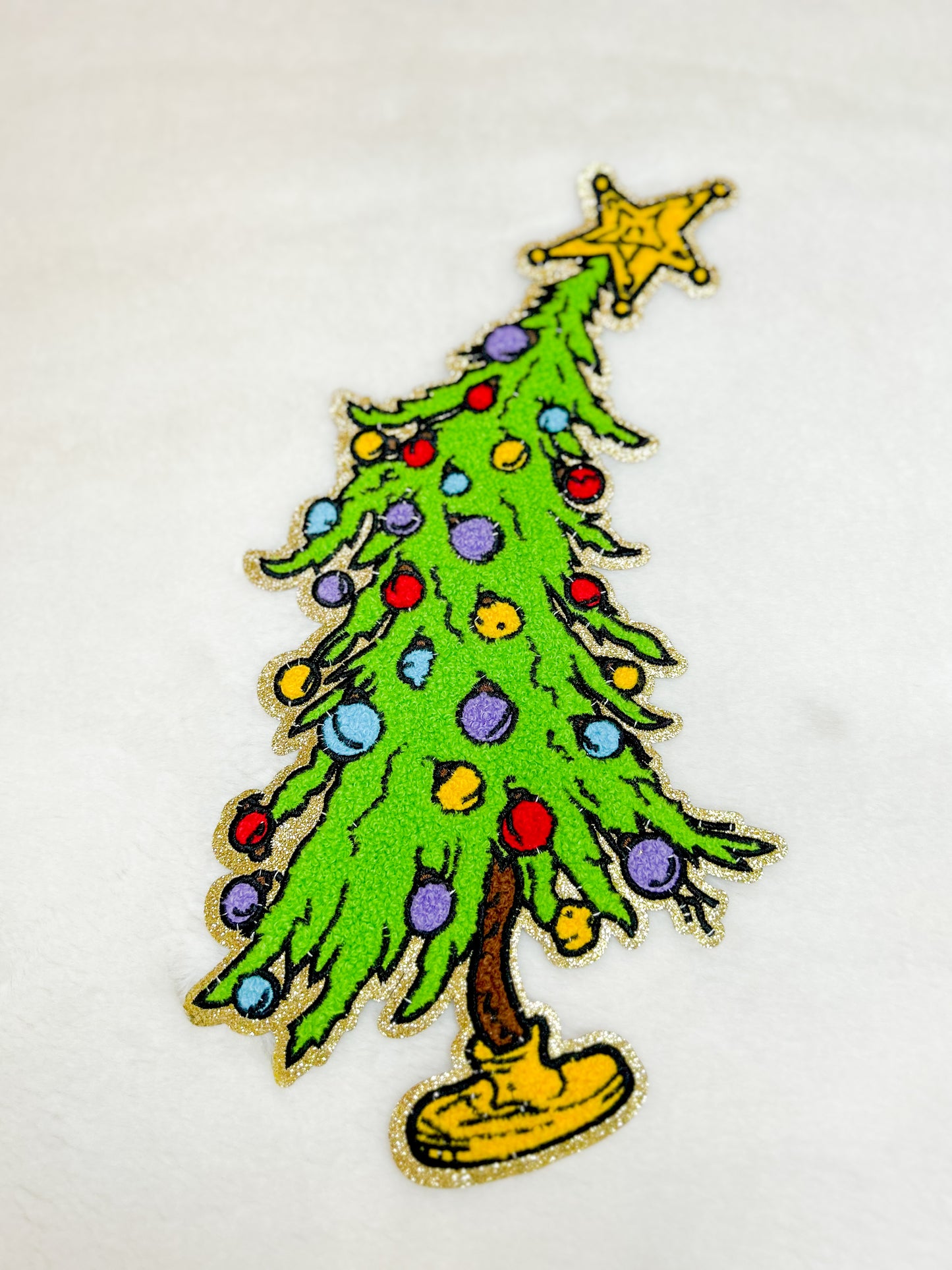 Patch-Leaning Christmas Tree with Ornaments