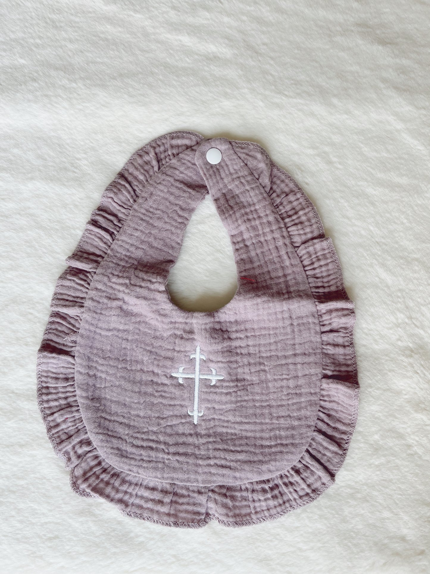 Ruffle Bib with Embroidered Cross