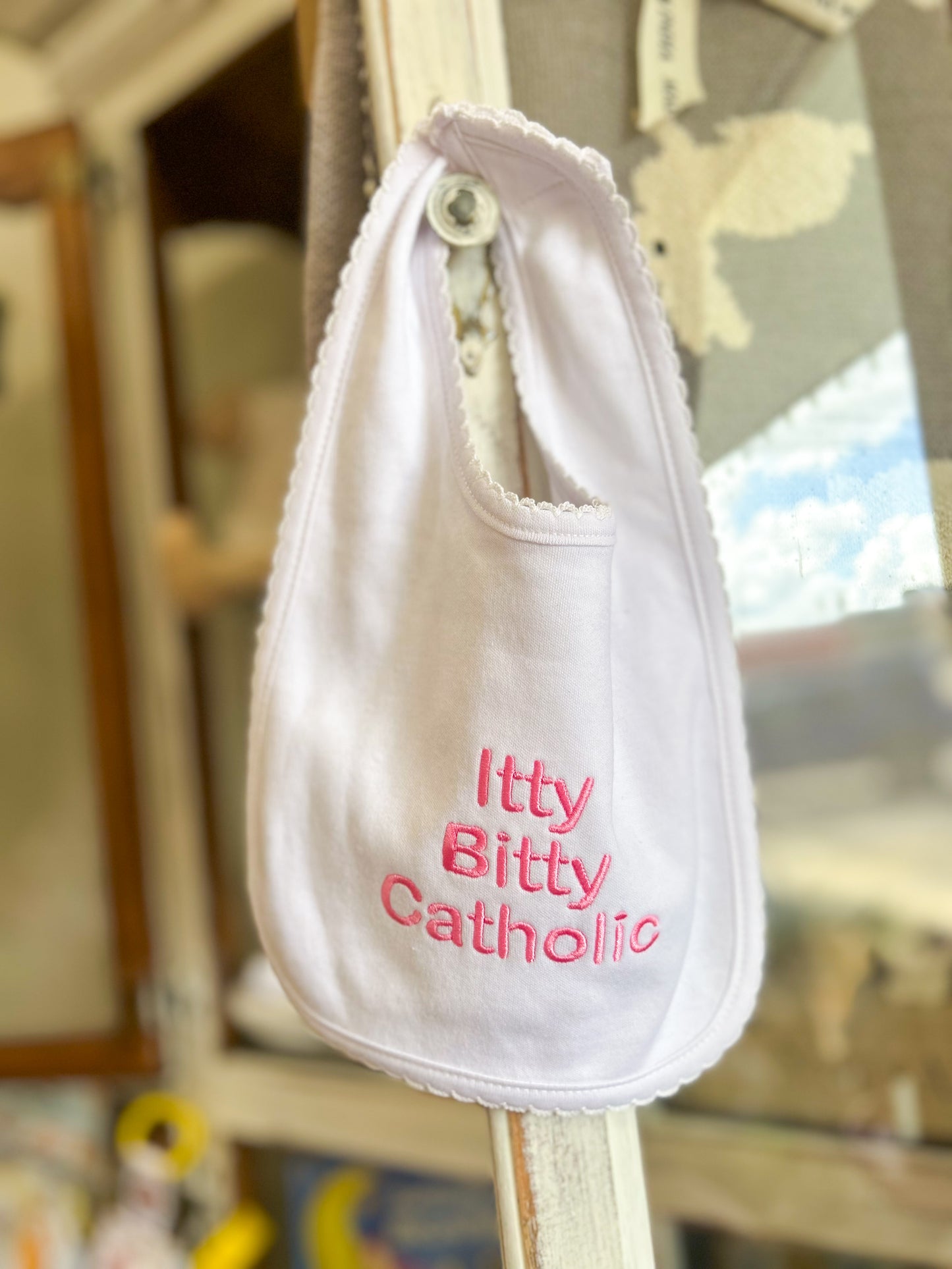 White Itty Bitty Catholic Bib- Pink