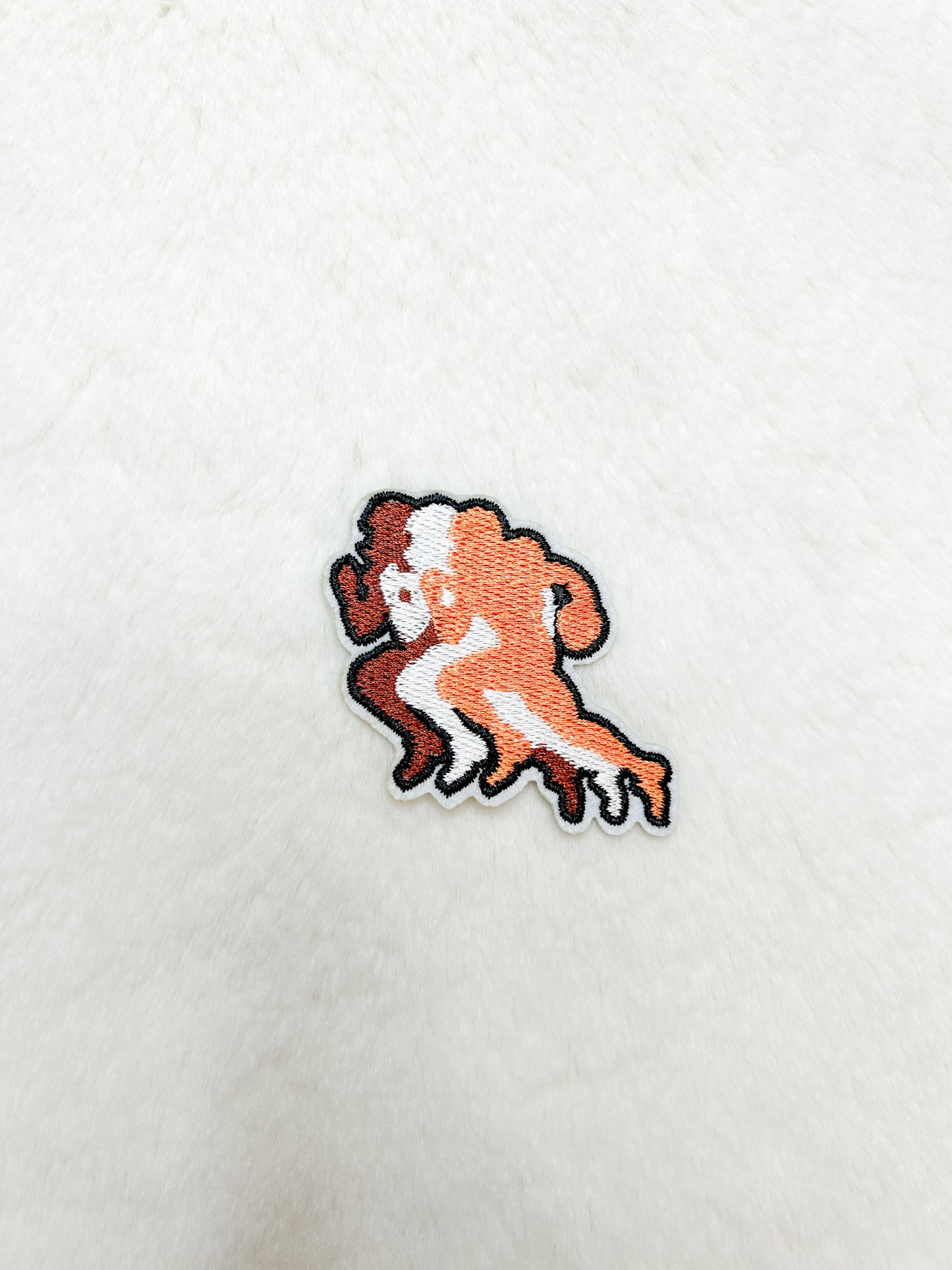 Patch-Running Orange Football Player