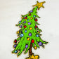 Patch-Leaning Christmas Tree with Ornaments