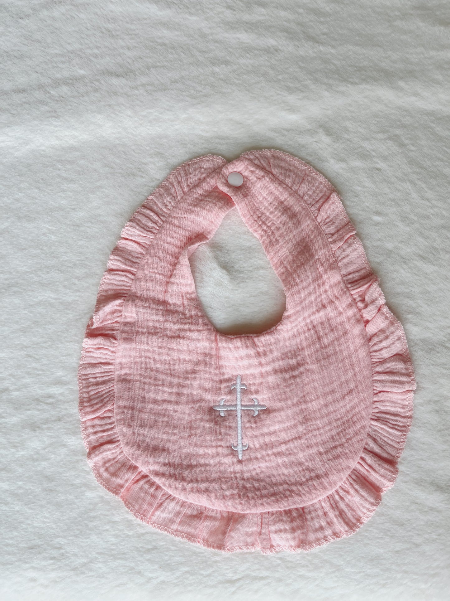 Ruffle Bib with Embroidered Cross