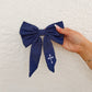 Clara Denim Bow With Cross