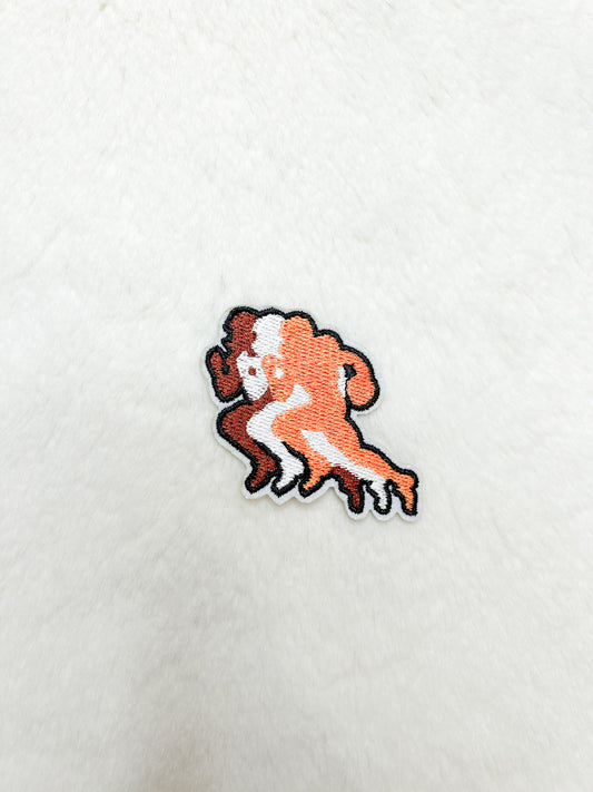 Patch-Running Orange Football Player